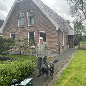 Voorzitter met zijn geleidehond Mac